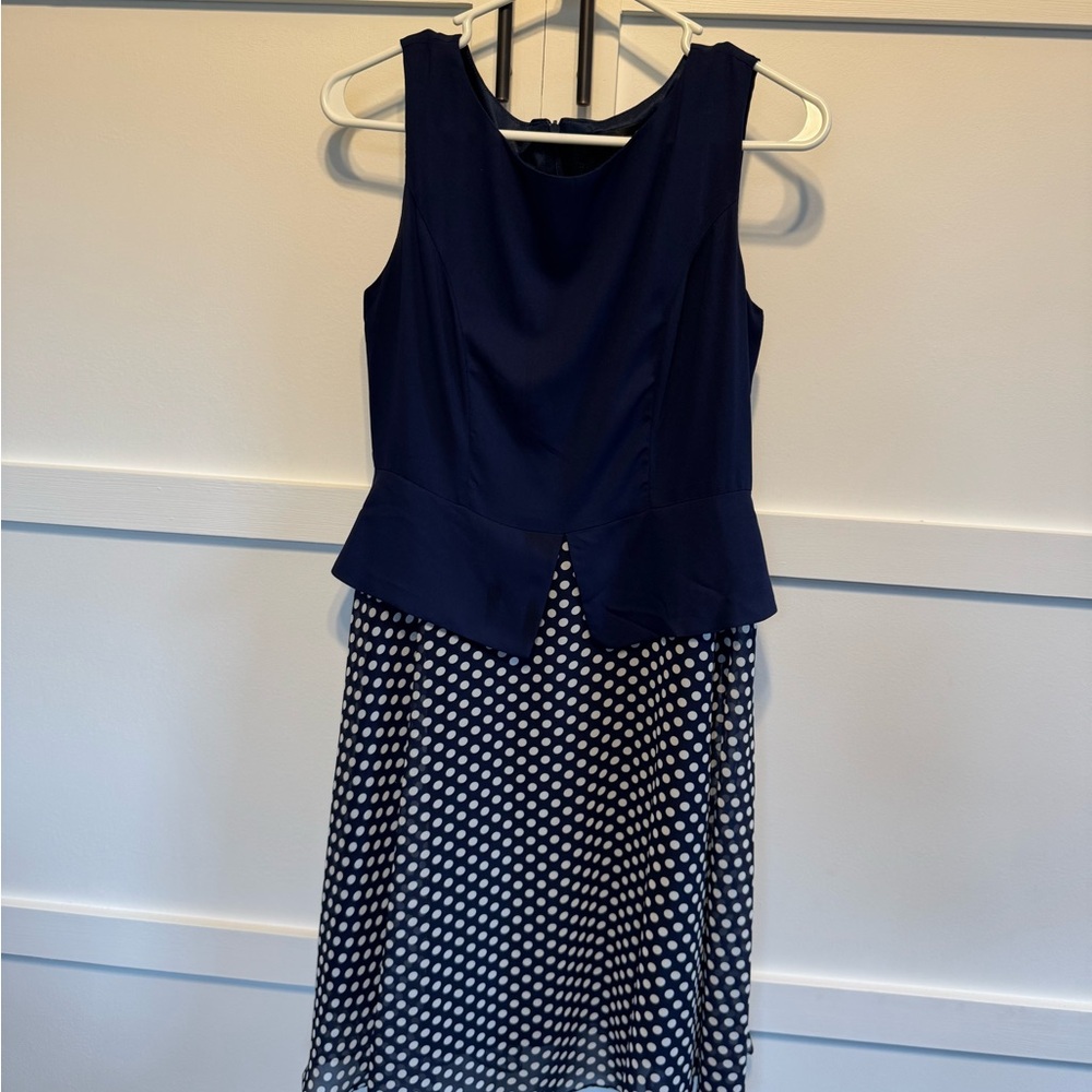 Chic Navy Sleeveless Dress with Polka Dot Skirt